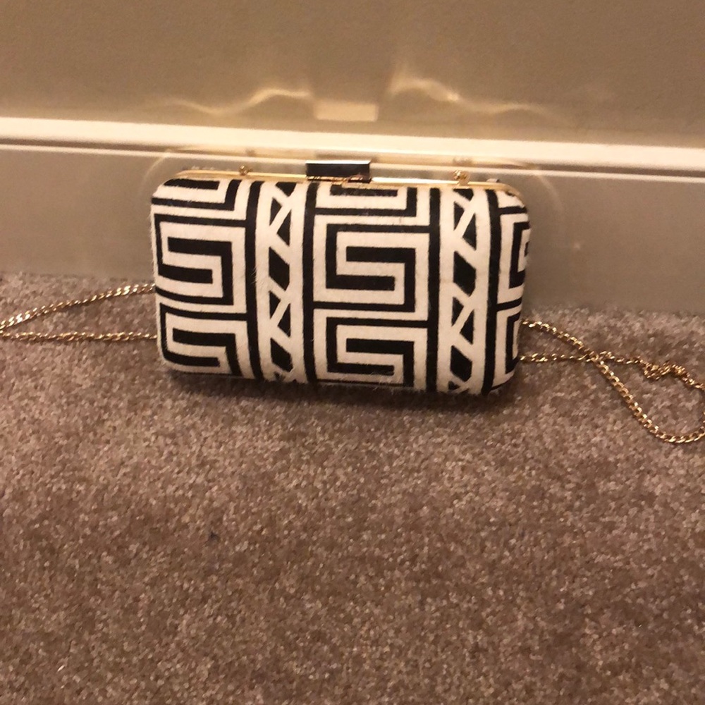 Bebe calf hair leather clutch